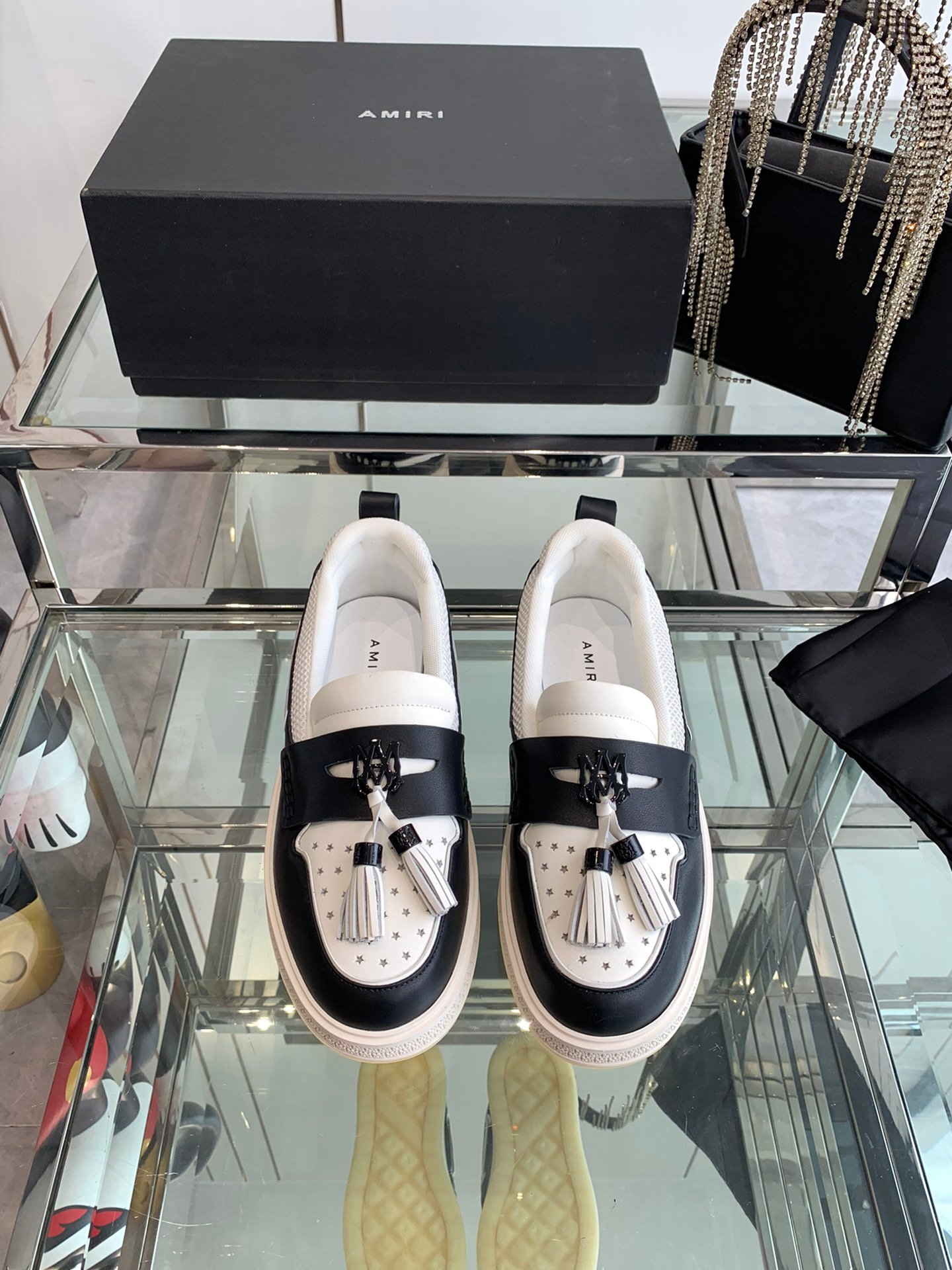Amiri MA Tassel Hybrid Loafers in Black and White Leather.