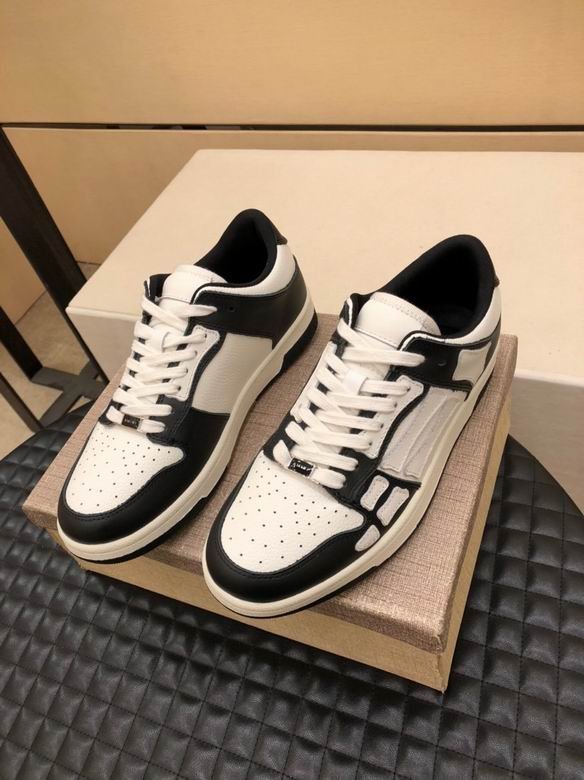 Amiri Skel-Top Low Sneakers in Black and White.
