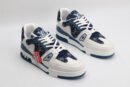 "A pair of IndigoDenim Blue and White Urban Sneakers, viewed at an angle, showcasing their low-top design, white laces, blue patterned denim-like textile sections, white leather overlays, and blue rubber outsole