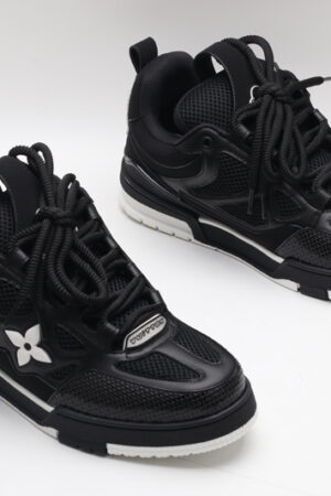 A pair of black Louis Vuitton LV Trainer sneakers