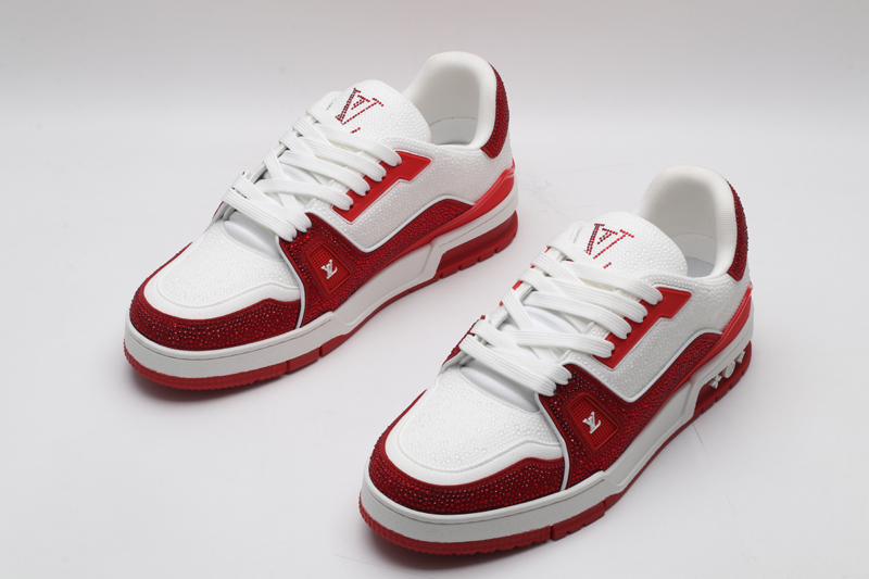 A single red and white Louis Vuitton LV Trainer sneaker, covered in glittering red crystal embellishments, with "VUITTON" visible on the outsole.