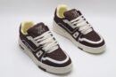 A single brown Louis Vuitton LV Trainer Low-Top Sneaker, showcasing its embossed monogram suede and off-white accents.