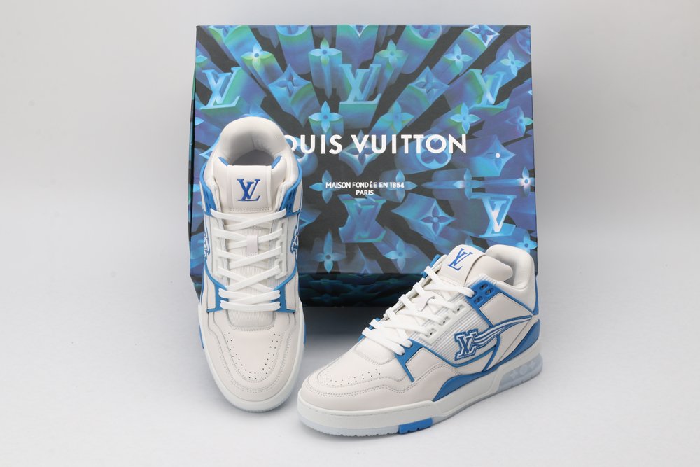 A pair of white and blue Louis Vuitton LV Trainer sneakers with clear sole elements revealing LV monograms