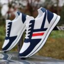 A pair of low-top unisex canvas shoes in a clean, classic design with a simple silhouette.