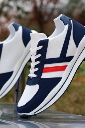 A pair of low-top unisex canvas shoes in a clean, classic design with a simple silhouette.