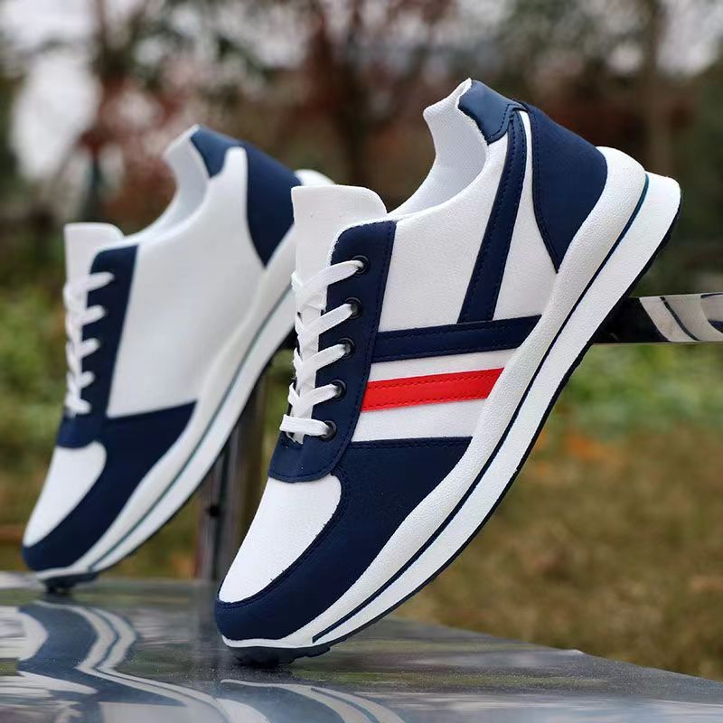 A pair of low-top unisex canvas shoes in a clean, classic design with a simple silhouette.