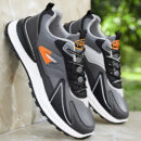 A pair of low-top unisex athletic sneakers in a black and white color scheme with a sporty, layered design.