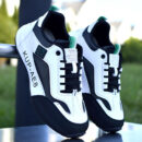 A pair of unisex athletic sneakers in blue, gray, and black with a modern design and a cushioned sole.