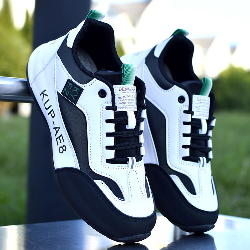 A pair of unisex athletic sneakers in blue, gray, and black with a modern design and a cushioned sole.