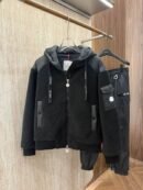 A Moncler hybrid jacket combining quilted, down-filled panels on the body with solid fleece sleeves, featuring the Moncler logo patch.