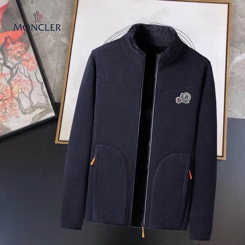 A full-body image of a dark Moncler hooded puffer jacket with horizontal quilting and the Moncler logo patch visible on the chest.