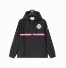 A black hooded sport windbreaker jacket featuring a horizontal red, white, and navy stripe across the chest and a white circular logo emblem.