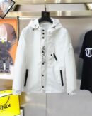 Close-up of the crisp white performance fabric and the bold "MONCLER" typography on the front placket of a premium utility jacket.