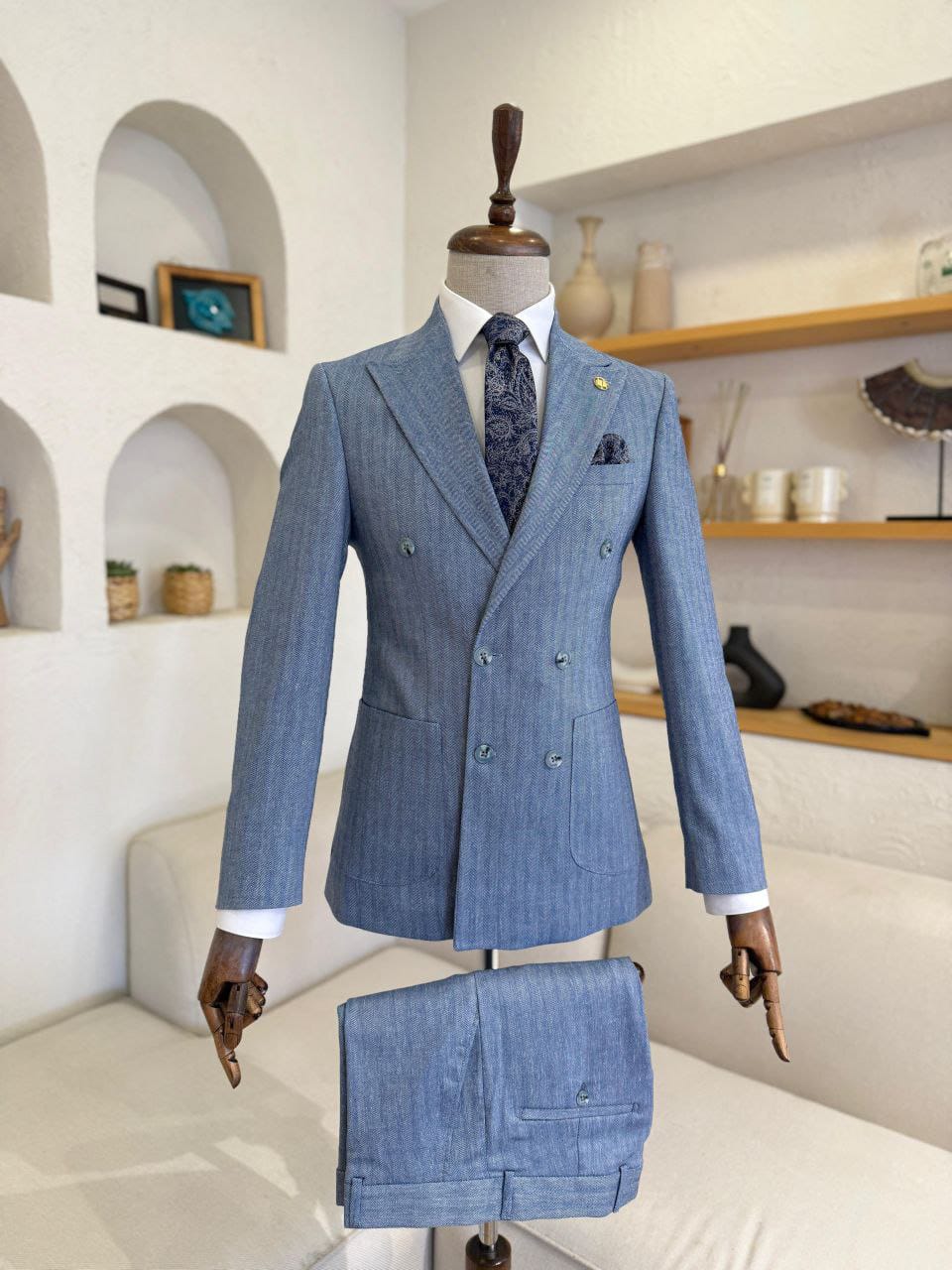 Herringbone Double-Breasted Suit with a patterned tie and matching pocket square.