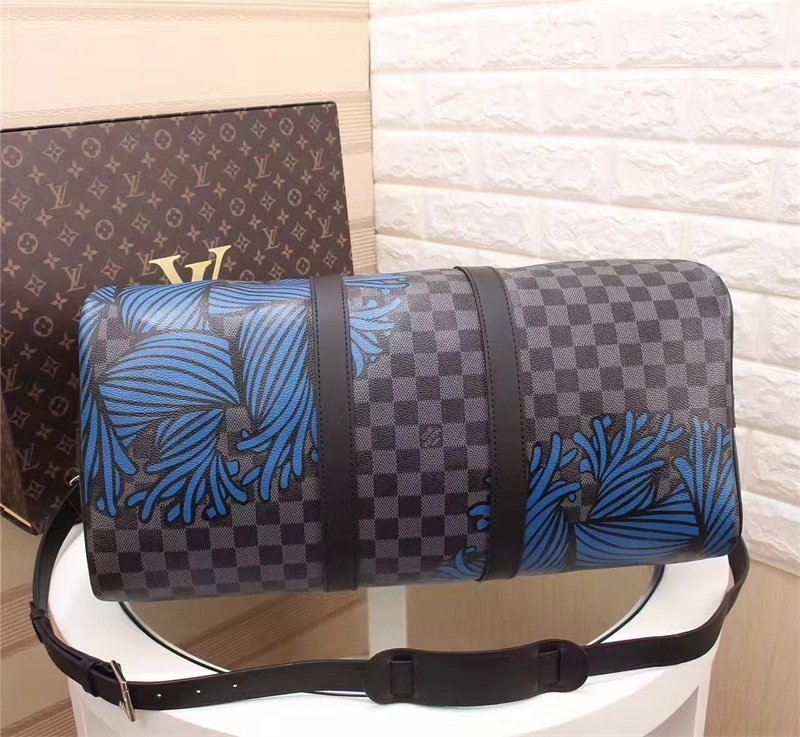 A high-quality Louis Vuitton inspired Nemeth Keepall travel bag in Damier Graphite canvas with blue rope illustrations and black leather trim.