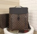 A high-quality Louis Vuitton inspired Steamer backpack with monogram canvas, black leather top flap, silver buckle, and two vertical front zippers.