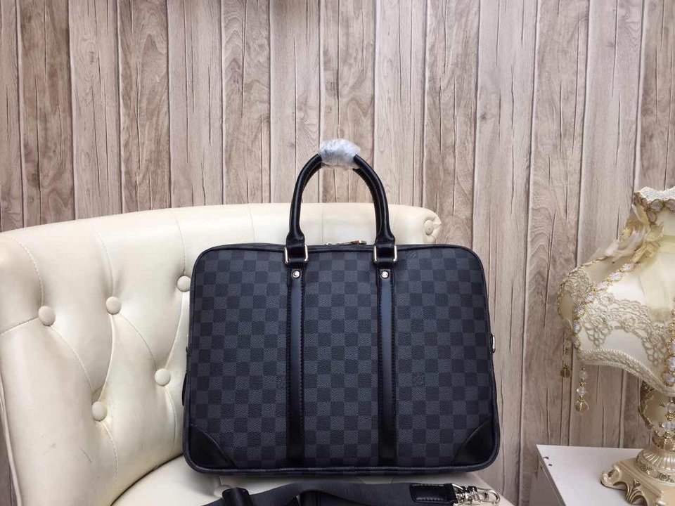 A high-quality Louis Vuitton inspired Porte-Documents Voyage briefcase in black and charcoal Damier Graphite canvas with black leather trim.