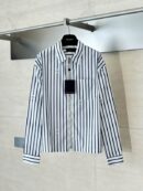 A premium men's white t-shirt featuring a large black Valentino VLogo signature on the chest, and a premium black t-shirt with a subtle pink embroidered VLogo on the left chest