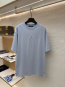 A premium men's sky blue cotton t-shirt featuring a tonal "LV" logo embroidered on the center chest.