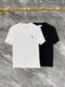 Two men's short-sleeve t-shirts in white and black, each featuring a large, bold YSL block logo printed in contrasting colors on the center chest.