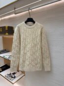 A cream-colored long-sleeve crewneck sweater featuring an all-over raised Dior Oblique monogram knit pattern.