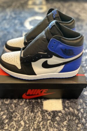 : A top-down view of Union LA x Air Jordan 1 Retro High OG sneakers resting on their original themed box.