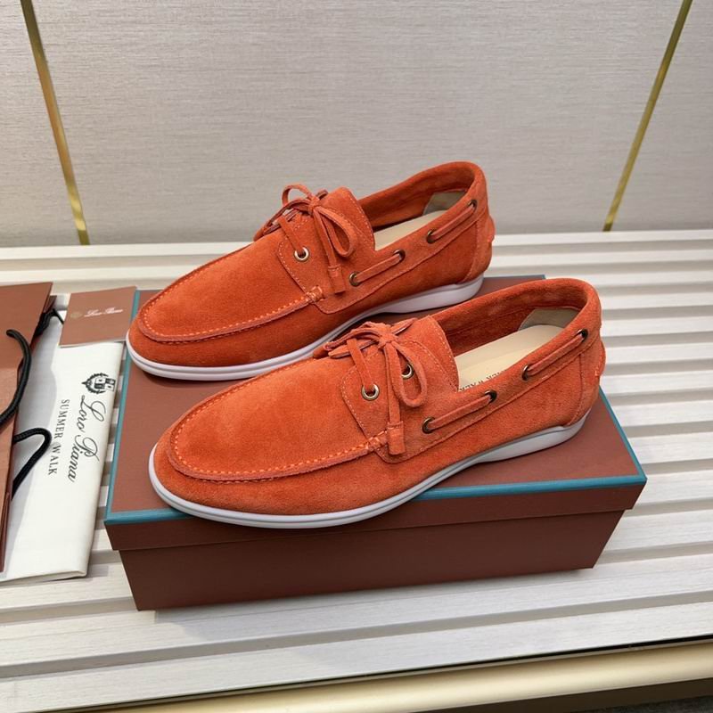 A pair of Burnt Orange Suede Summer Walk boat shoes with white rubber soles and matching orange laces, displayed on an orange box with authenticating materials.