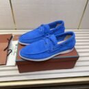 A pair of vibrant royal blue suede Loro Piana Summer Walk loafers with white soles sitting on a brown product box.